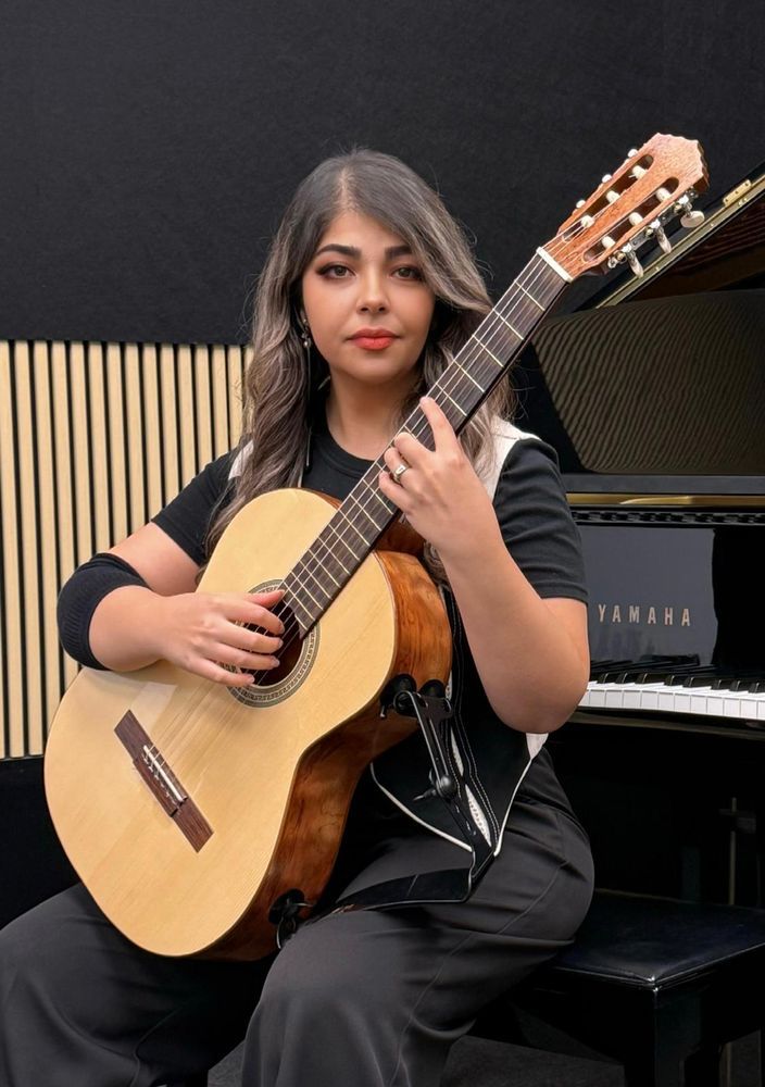 Arezoo Sanaei with her classical guitar